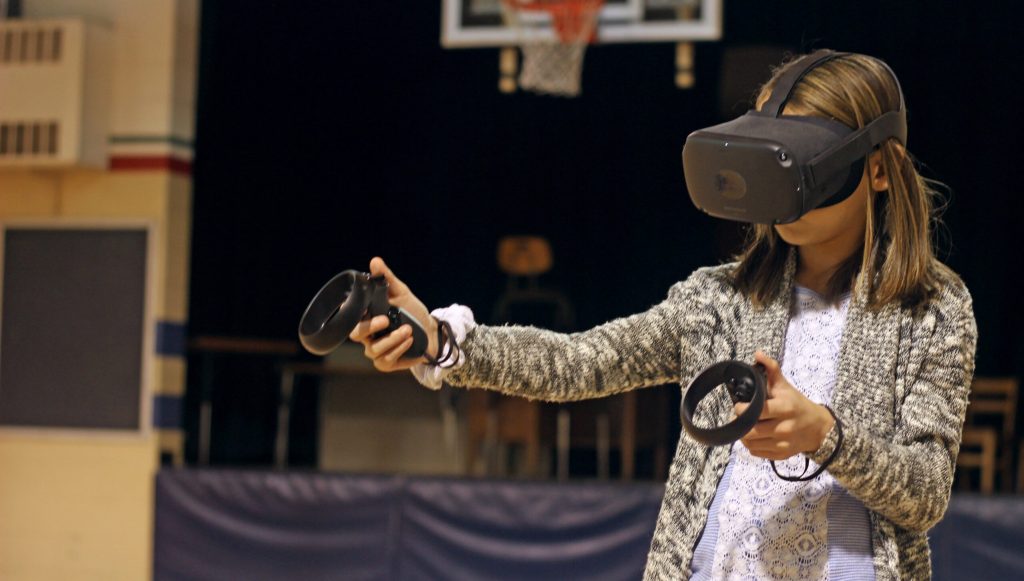 woman using black virtual reality headset 2