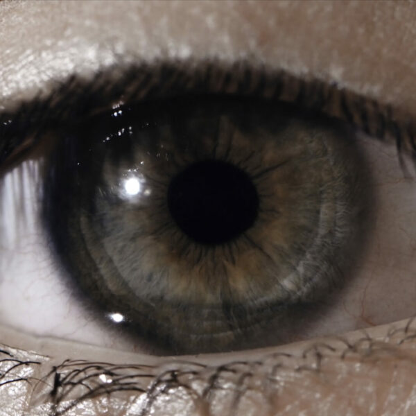 Eye pupil reaction to light. Humans eye macro shot with light-flash apple of eye reaction.