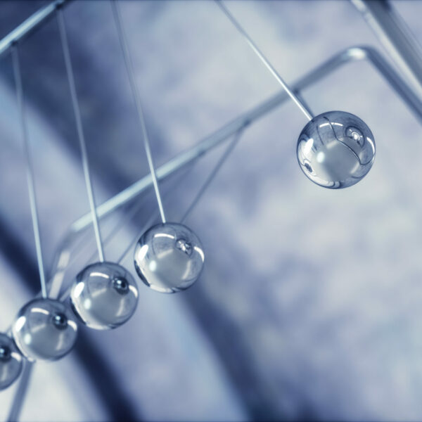 3D illustration of Newton's cradle, concept of conservation of momentum and energy.